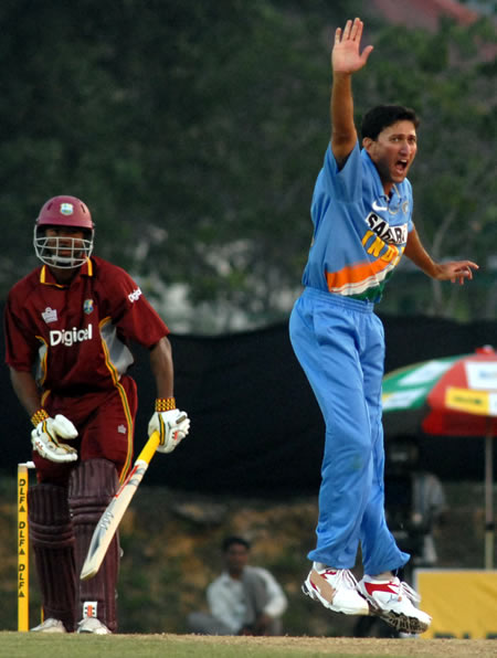 Agarkar celebrates after taking a wicket