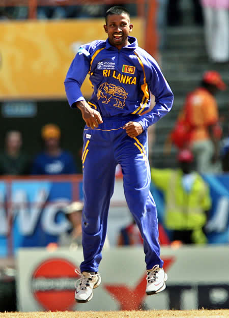 Russel Arnold celebrates the wicket of Gilchrist
