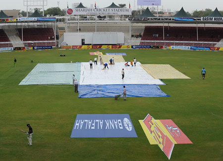 The rare sight of rain delaying play in Sharjah