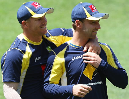 David Warner and Phillip Hughes during a training session at the Gabba