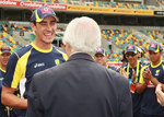 Richie Benaud presents Mitchell Starc with his baggy green
