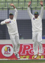 Younis Khan and Misbah-ul-Haq are delighted after the fall of Nasir Hossain