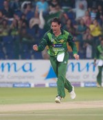 Saeed Ajmal smiles after taking a wicket