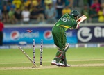 An image showing Saeed Ajmal getting bowled