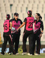 Erin Bermingham of New Zealand(R) celebrates a wicket with team mates