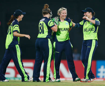 Ciara Metcalfe of Ireland is congratulated after taking the wicket of Trisha Chetty of South Africa