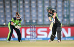 Ellyse Perry of Australia bats with Mary Waldron of Ireland looking on
