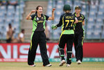 Megan Schutt of Australia celebrates the wicket of Clare Shillington of Ireland with team mates