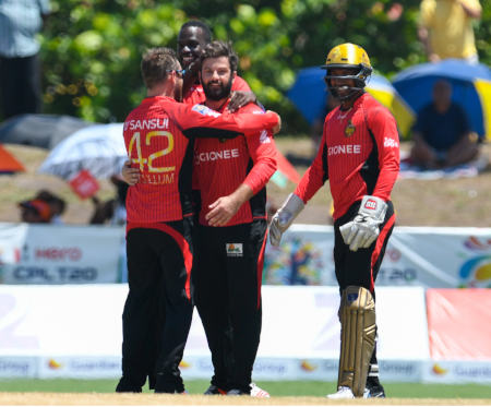 Knight Riders celebrate after getting a wicket