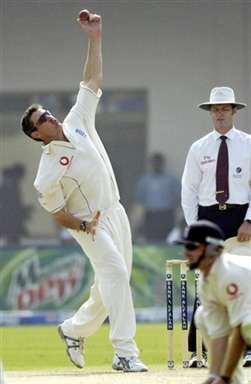 Ashley Giles about to deliver a ball