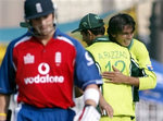 Mohammad Asif celebrates with Abdul Razzaq after taking a wicket