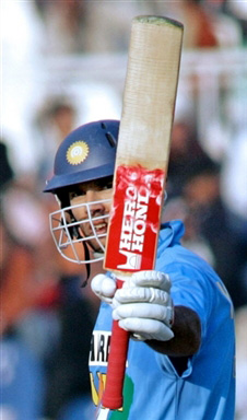 Yuvraj Singh waves his bat after his 50