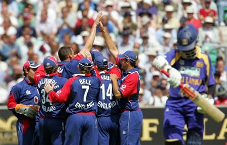 England cricketers celebrate the wicket of Tharanga